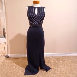 Tadashi sleeveless black gown w/graphite trim. Mesh back, knee high slit. sz SM.